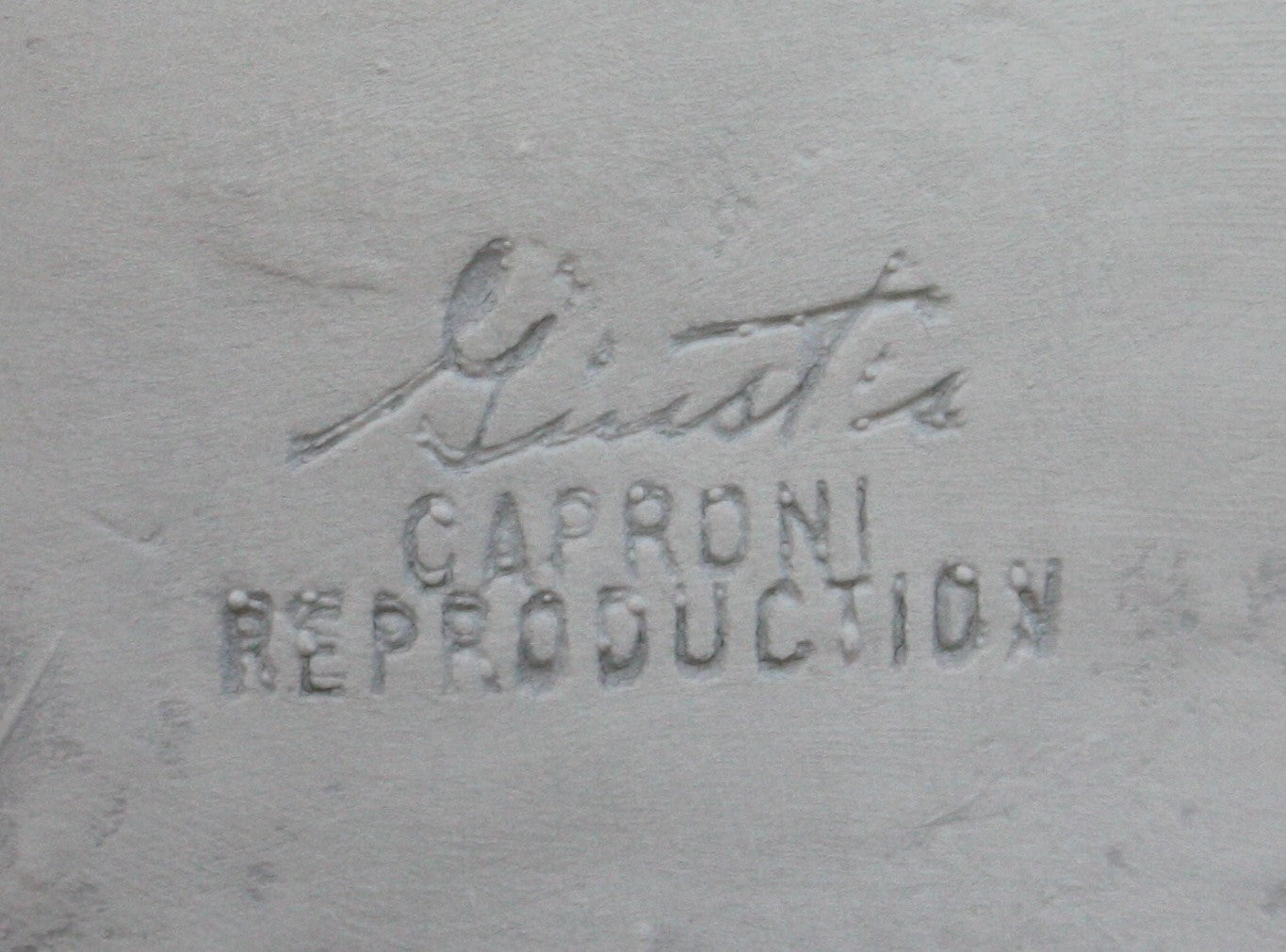 Photo of company stamp in a plaster cast sculpture