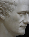 photo closeup with black background of plaster cast bust of Alexander Hamilton