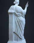 photo of plaster cast sculpture of female figure in robes leaning on podium