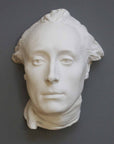 photo with gray background of plaster cast of male face, namely Lafayette, with neckerchief