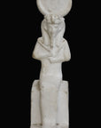 photo with black background of plaster cast sculpture of Egyptian mummy seated