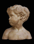 photo of plaster cast bust of boy on a black background