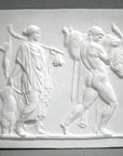 photo of plaster cast sculpture relief with two figures walking towards the right, the male, Hercules, carrying a boar, and the female carrying 