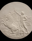 photo of plaster cast relief sculpture of nude male figure in horse-drawn chariot flying