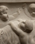 closeup photo of plaster cast relief sculpture of several putti around a goat celebrating the god Bacchus