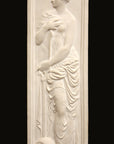 photo of white plaster cast relief sculpture of female figure in drapery