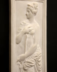 photo of white plaster cast relief sculpture of female figure in drapery