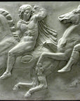 photo of off-white plaster cast relief sculpture of two men on horseback from Parthenon against black background