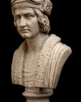 photo of plaster cast sculpture bust of man, namely Christopher Columbus, in robes and hat with black background