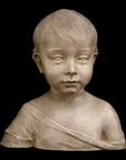 photo of plaster cast sculpture of boy from shoulders up with light tunic slipping off left shoulder with black background