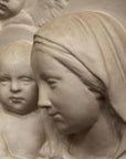 photo closeup of plaster cast relief of Madonna holding the Baby Jesus