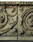 photo of plaster cast of architectural ornament with scroll and leaves against white background